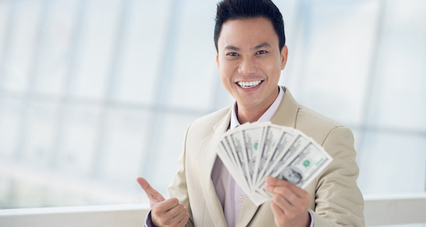Asian Man With Money Showing Thumbs Up